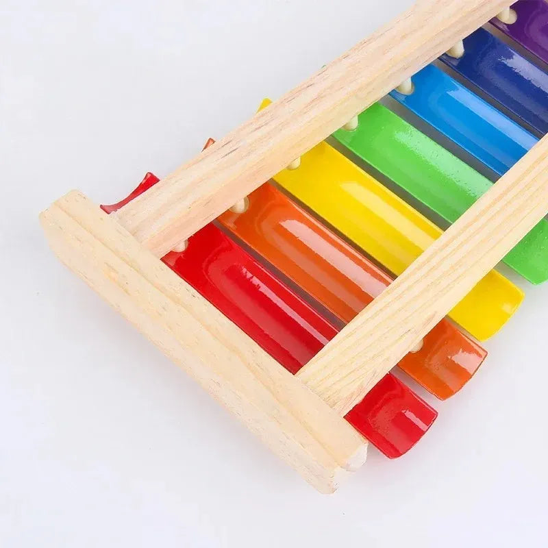 Close-up of wooden xylophone frame and colorful keys