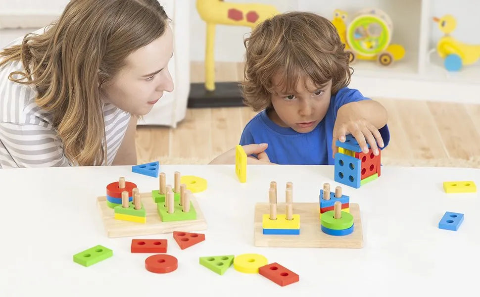 Child and parent playing with Wooden Geometric Stacking Toy at table