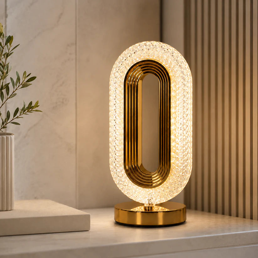 Oval crystal lamp gold base in luxury interior setting