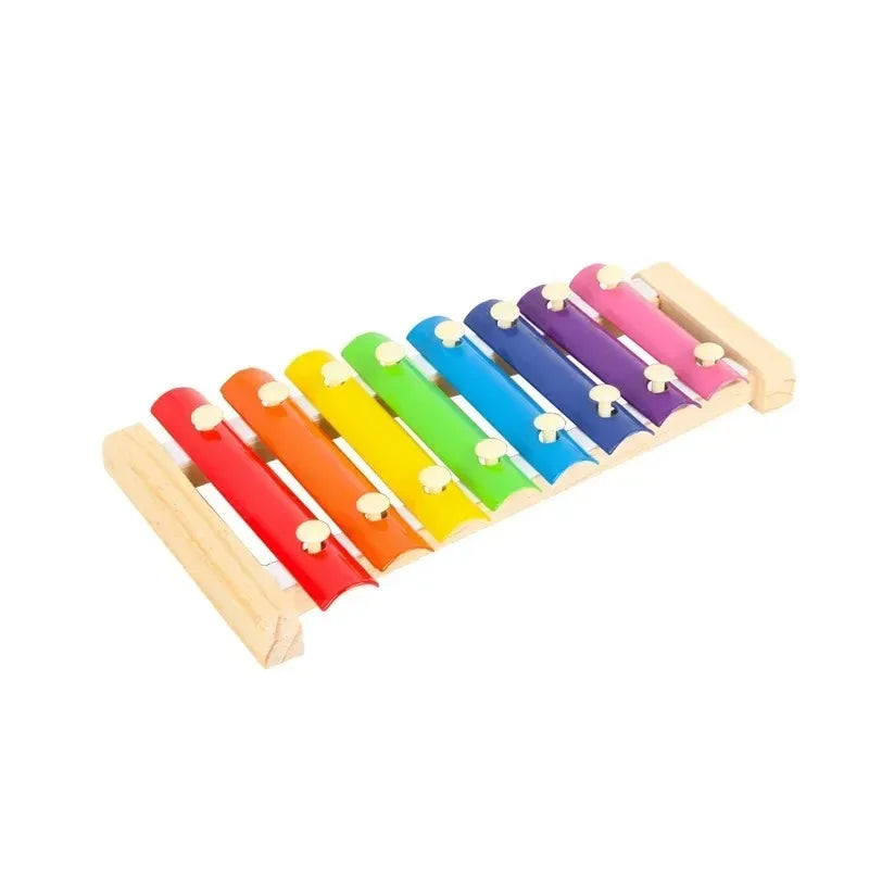 Wooden xylophone toy on white background side view
