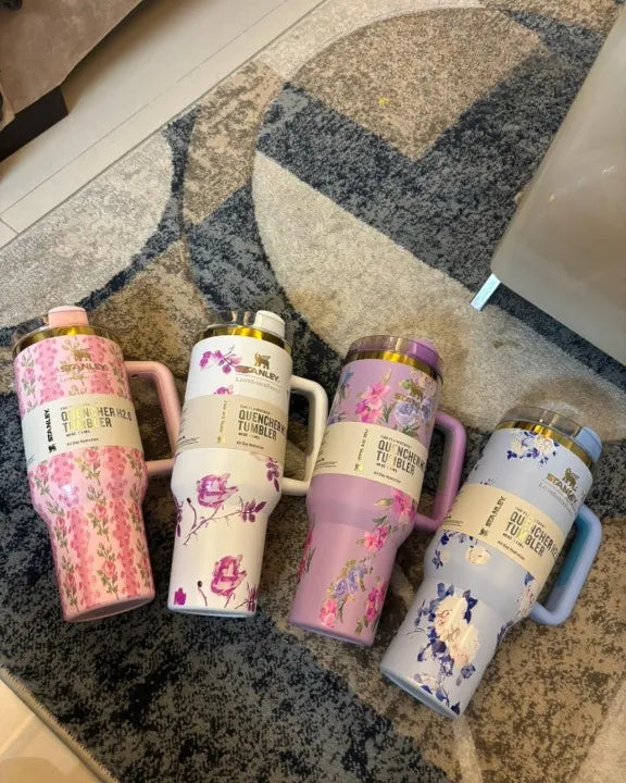 Stanley Quencher H2.0 floral tumblers in pink, blue, purple and white