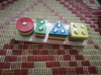 Wooden geometric shape stacker toy
