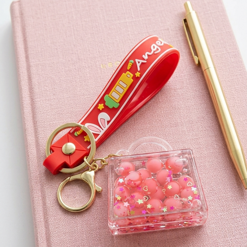 Pink bubble keychain editorial flat lay