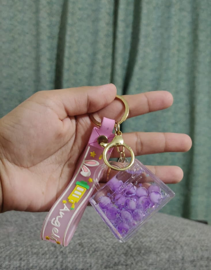 Green bubble keychain in hand