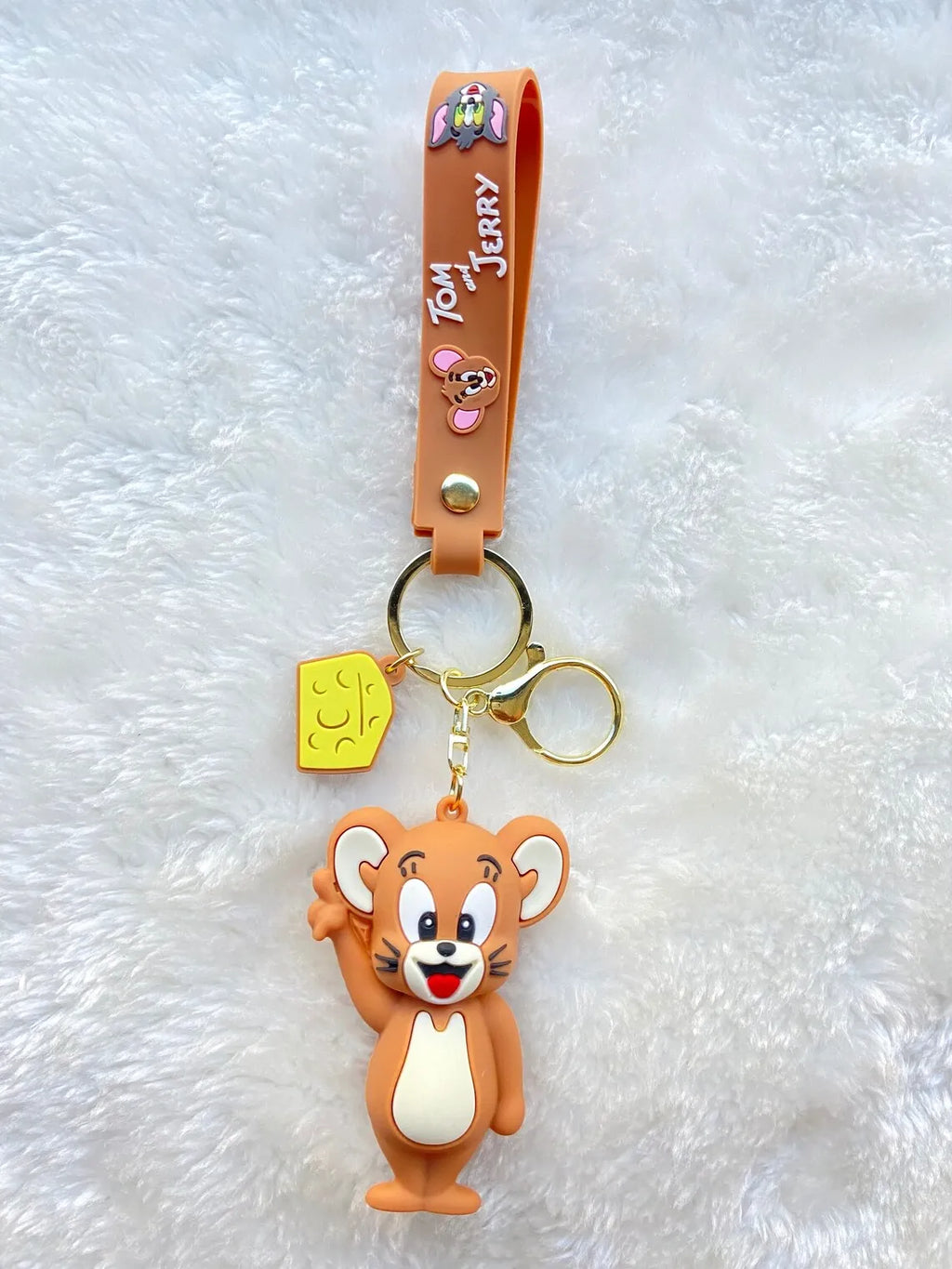 Jerry 3D rubber keychain standing pose on white fur surface