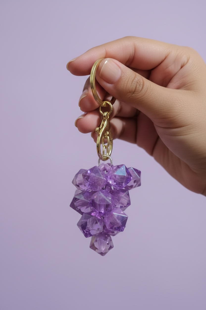 Purple crystal grape keychain editorial close up